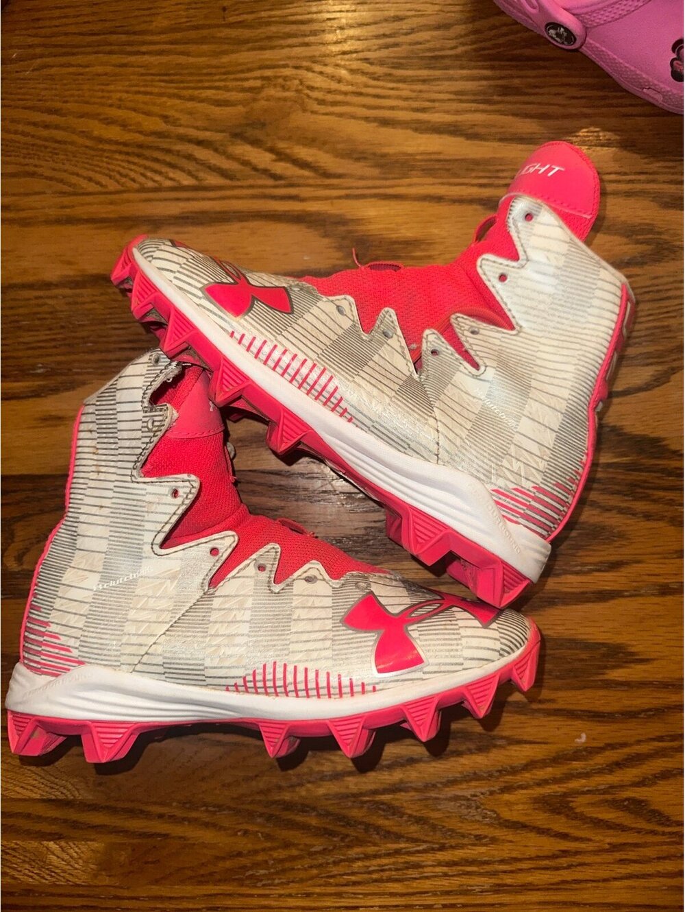 Under armour highlight hot pink and white cleats size 1.5 with shoe strings